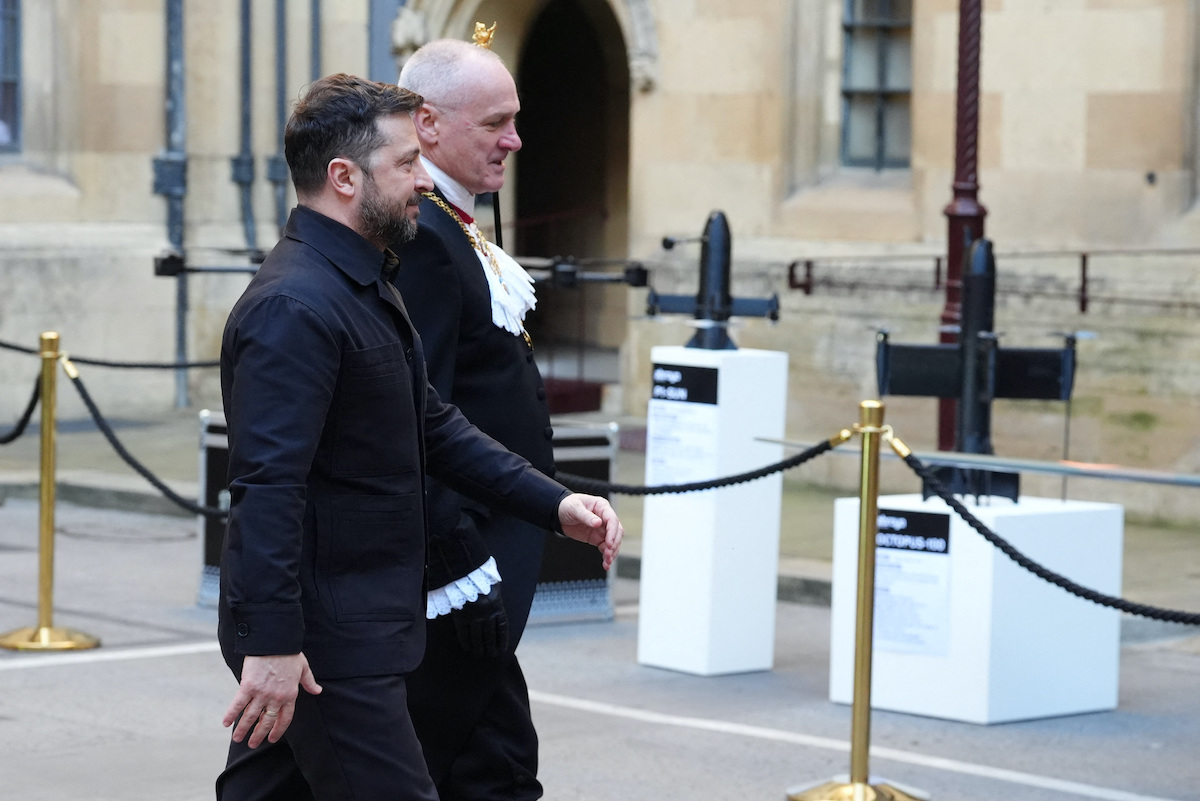 President Volodymyr Zelensky arrives at the Palace of Westminster in London, passing a display of Ukrainian air-defense technology, on Tuesday. (Reuters)