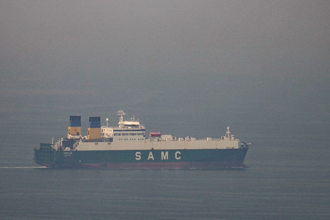 A cargo ship sails in the Arabian Gulf towards Strait of Hormuz in United Arab Emirates, Sunday, March 15, 2026. (AP)
