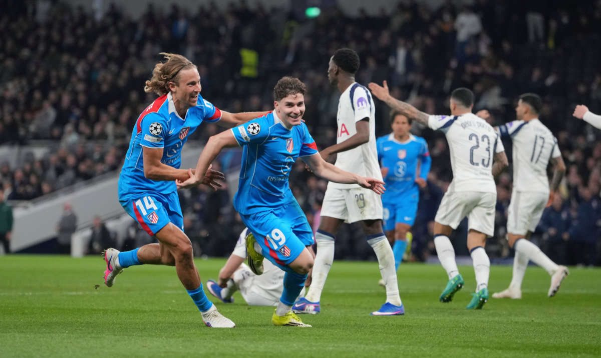 Atletico Madrid's Julian Alvarez, second from left, celebrates with Atletico Madrid's Marcos Llorente after scoring his side's first goal during the Champions League round of 16, second leg soccer match between Tottenham and Atletico Madrid in London, England, Wednesday, March 18, 2026. (AP)