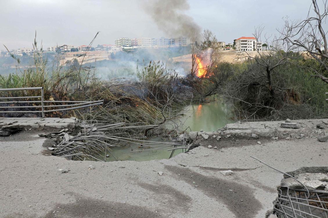This photograph shows the destroyed Qasmiye Bridge built over the Litani River, following an Israeli airstrike, in Qasmiye on Mar. 18, 2026. (AFP)