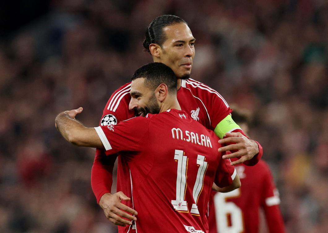 Liverpool’s Mohamed Salah celebrates scoring their fourth goal with Virgil van Dijk during their UEFA Champions League — Round 16 — Second Leg — match agaisnt Galatasaray — Anfield, Liverpool, Mar. 18, 2026. (Reuters)