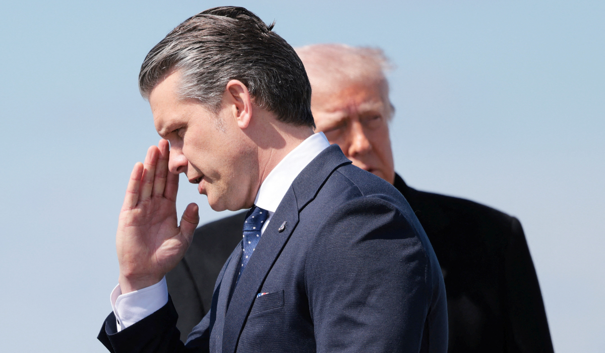US Secretary of Defense Pete Hegseth salutes, as he and President Donald Trump arrive at Dover Air Force Base in Dover, Delaware, US, March 18, 2026. (REUTERS)