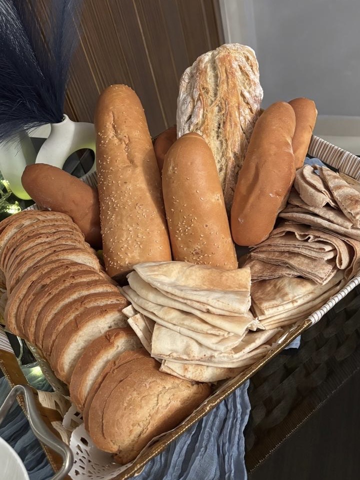 According to the King Abdulaziz Public Library, some regions maintain the practice of each household preparing a specific dish to share after Eid prayer. Neighbors gather in designated areas, often arranged with carpets, where meals are shared. (Supplied)