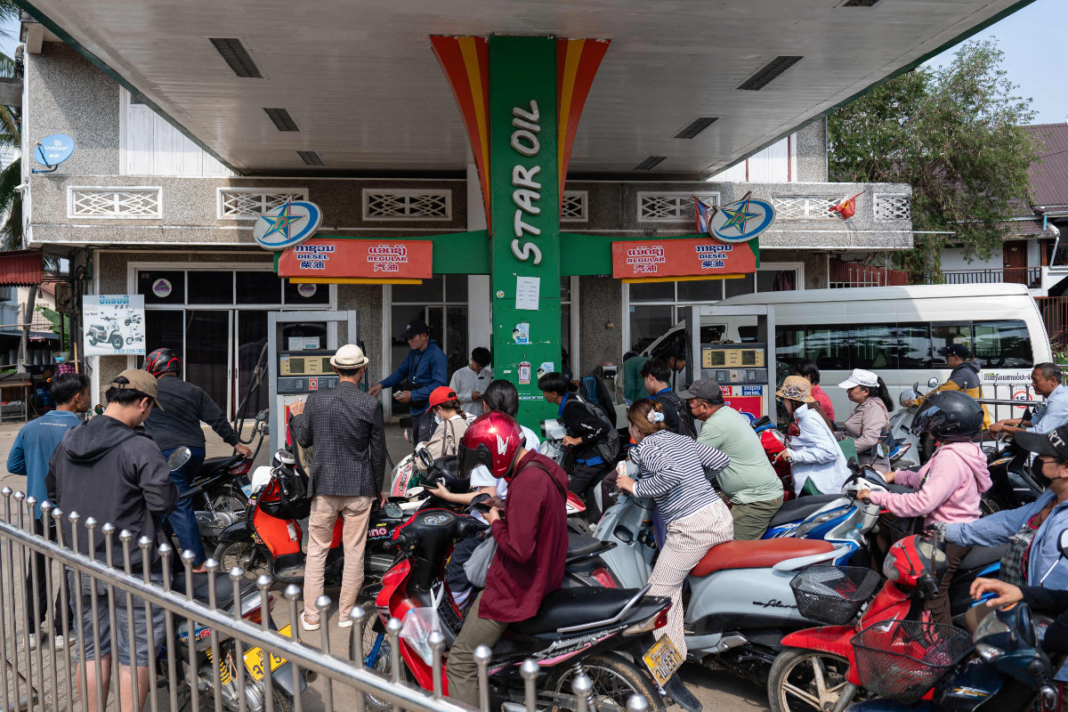 Motorists queue up at a Star Oil petrol station in Luang Prabang, Laos, on March 16, 2026, following import disruptions caused by the Middle East war. (AFP)