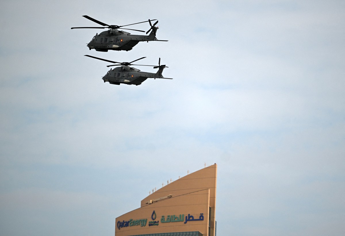 Helicopters, part of the Qatari Air Force, take part in a flypast during celebrations marking Qatar National Day, in Doha, Qatar. (AFP)