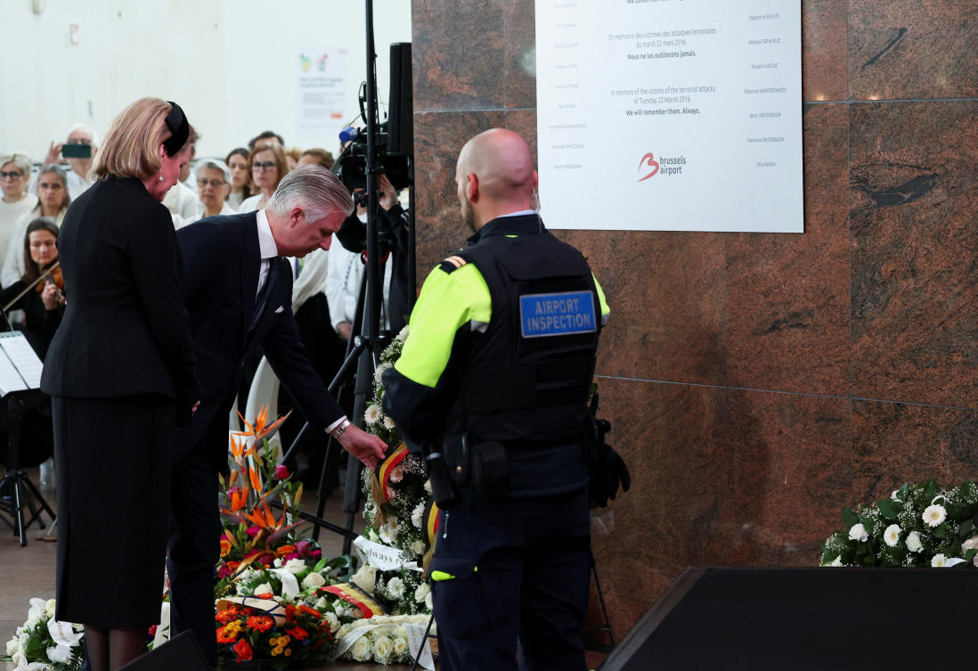 Belgium’s King Philippe and Queen Mathilde stand in front of a commemorative plaque on the 10th anniversary of the March 22, 2016 suicide bomb attacks. (Reuters)