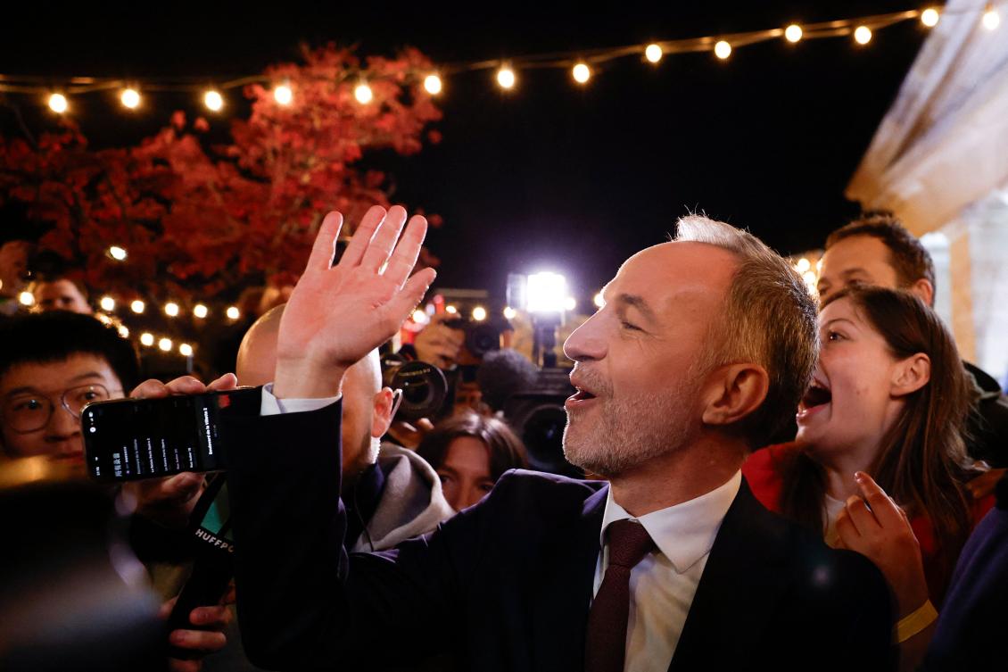Emmanuel Gregoire waves to supporters after his victory in Paris following the announcement of official results of the second round of France's 2026 municipal elections on Sunday. (AFP)