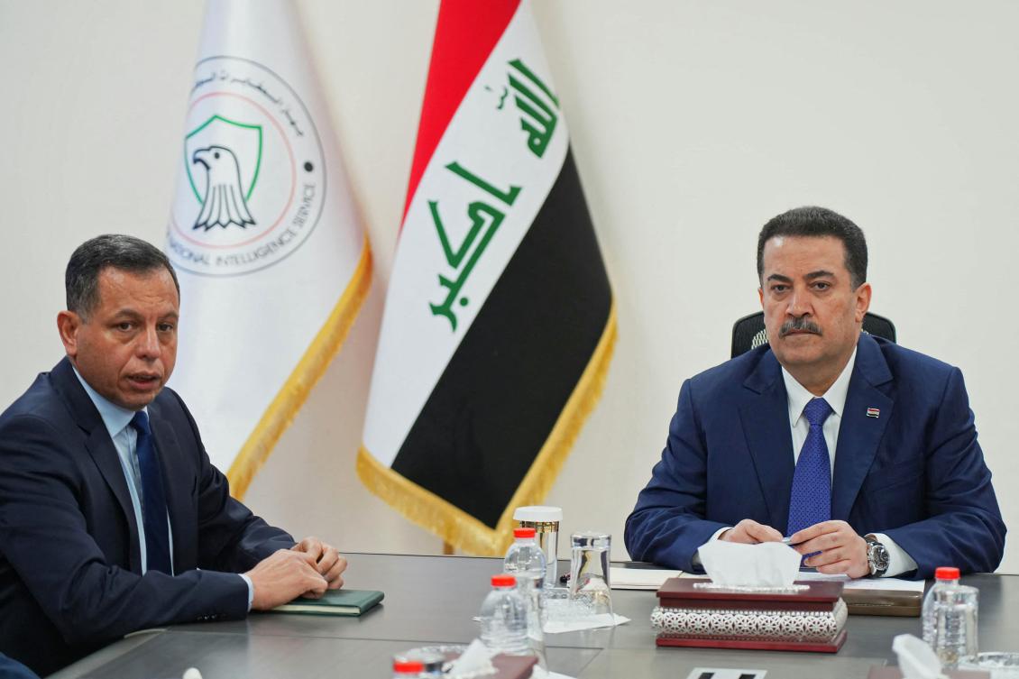Iraq's Prime Minister Mohammed Shia al-Sudani (R) and Iraqi National Intelligence Service (INIS) chief Hamid Al?Shatri attending a meeting. (FILE/AFP)