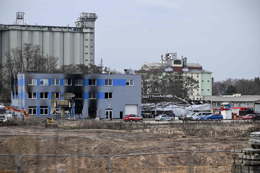 Firefighters and investigators check the scene of the burnt factory owned by Czech arms maker LPP Holding in Pardubicde city, East Bohemia, Czech Republic. (AFP)