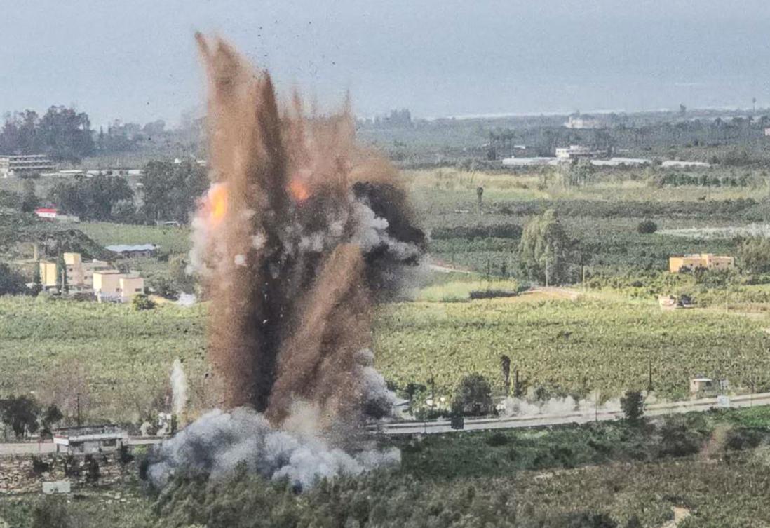 A fireball rises from the site of an Israeli airstrike that targeted the Qasmiyeh bridge, located on a main highway linking villages in the Tyre district with others further north, in southern Lebanon on March 22, 2026. (AFP)