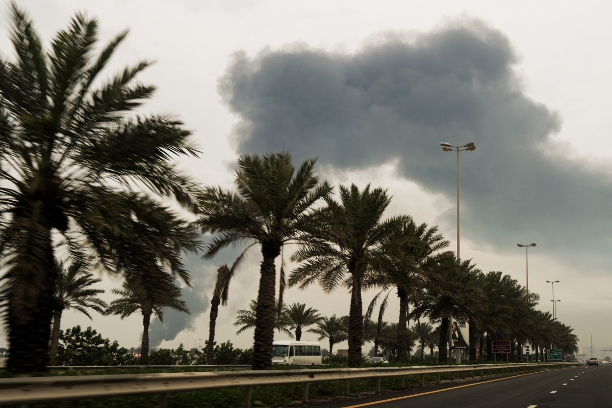 A plume of smoke rises after a reported Iranian strike on fuel tanks in Muharraq, Bahrain, March 12, 2026. (AFP)
