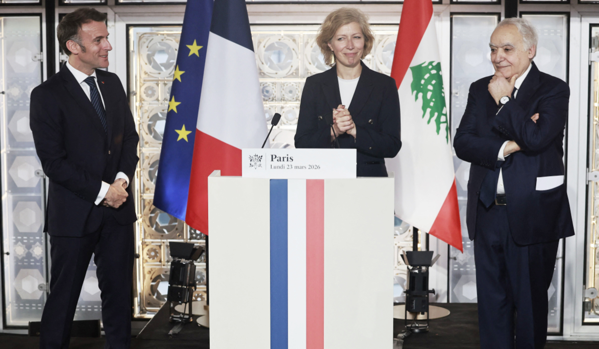 The new President of the Arab World Institute Anne-Claire Legendre (C) delivers a speech next to French President Emmanuel Macron (L) and Lebanese Minister of Culture Ghassan Salame during the opening of the exhibition "Byblos, Lebanon's Millennial City" at Arab World Institute (IMA) in Paris on March 23, 2026. (AFP)