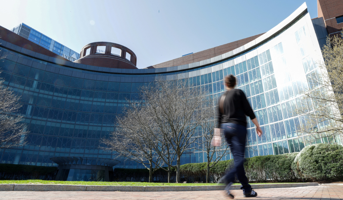 A person walks by the federal courthouse where a judge held an initial hearing in Harvard University's lawsuit seeking to block U.S. President Donald Trump from freezing billions of dollars in federal funding, in Boston, Massachusetts, U.S., April 28, 2025. (REUTERS)