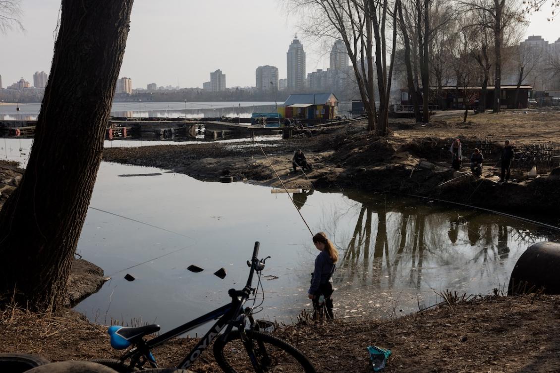 Anglers cast their fishing rods into a pond in Kyiv’s Obolon neighbourhood on March 23, 2026, amid Russia’s ongoing invasion of Ukraine. (FILE/AFP)