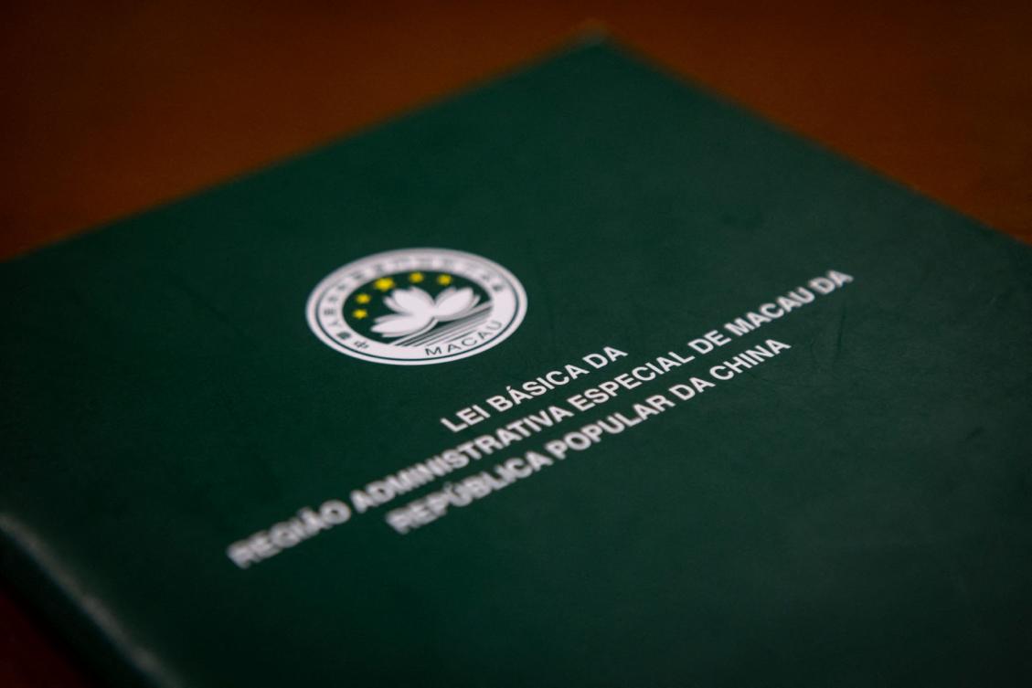 This photo taken on December 12, 2024 shows a book of Macau's Basic Law, in Macau. (File/AFP)