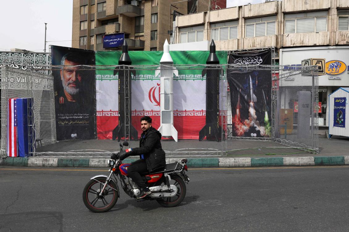Iran’s Energy Minister Abbas Aliabadi believes the country was less vulnerable than others in the region to any attacks on its energy infrastructure. Above, a motorist rides past the dummy models of Iranian missiles at the Valiasr Square in Tehran on March 22, 2026. (AFP)