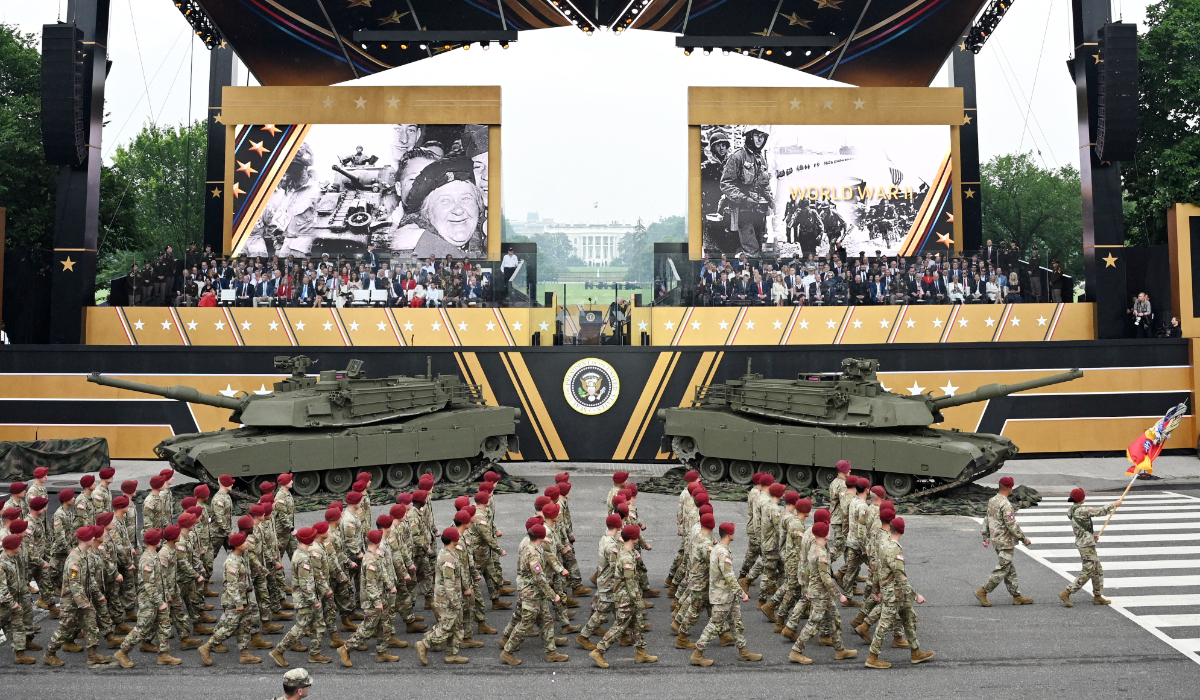 US President Donald Trump (C-R) watches as members of the 82nd Airborne Division march past during the Army 250th Anniversary Parade from the Ellipse in Washington, DC on June 14, 2025. (AFP)