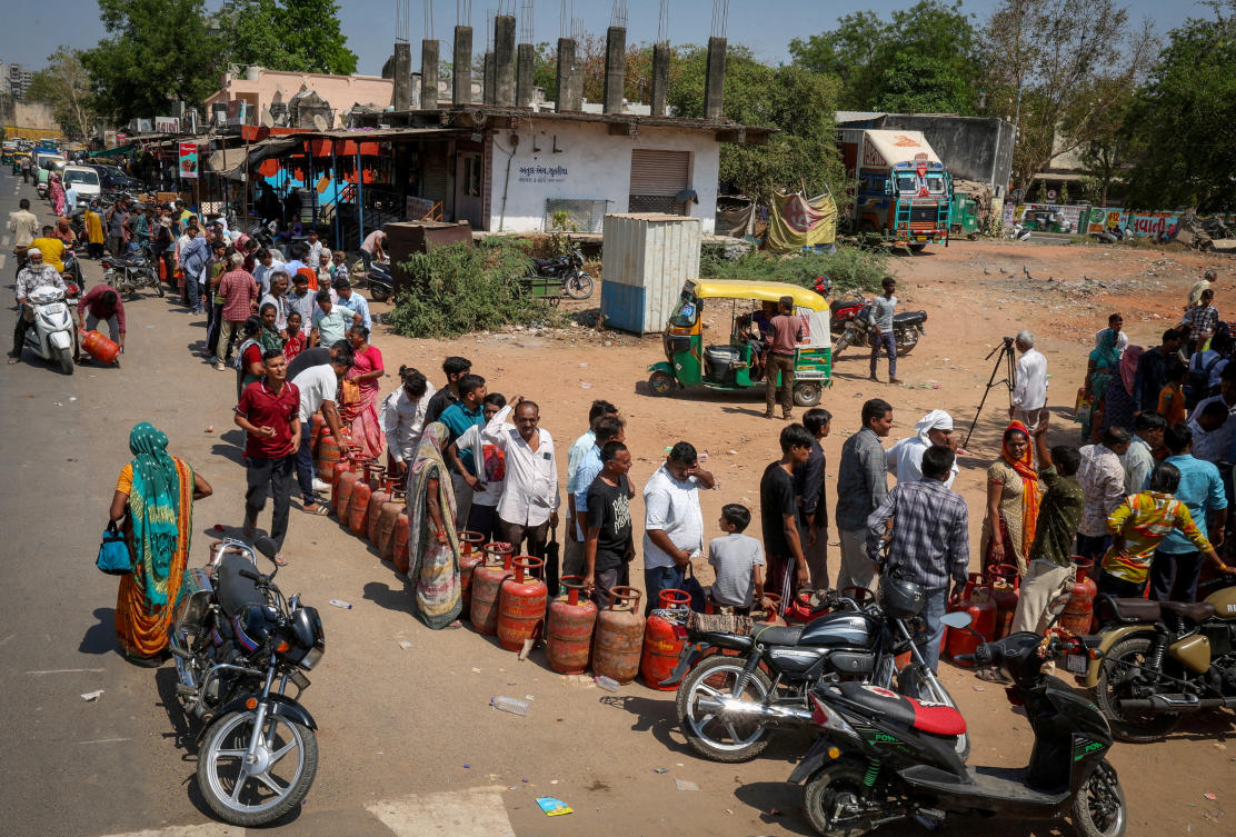 FILE PHOTO: FILE PHOTO: People stand in a queue with their empty LPG cylinders outside a gas agency amid supply disruptions following the U.S.-Israeli conflict with Iran, in Ahmedabad, India, March 12, 2026. (REUTERS)