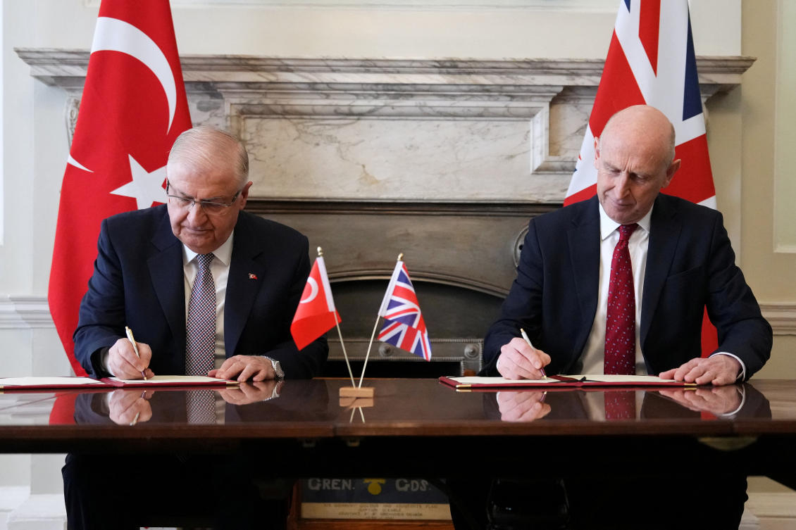 Britain's Secretary of State for Defence John Healey and Turkish Minister of National Defense Yasar Guler, sign an agreement that allows Turkey to purchase 20 Eurofighter Typhoon jets, in London, Britain, March 25, 2026. Kirsty Wigglesworth/Pool via REUTERS