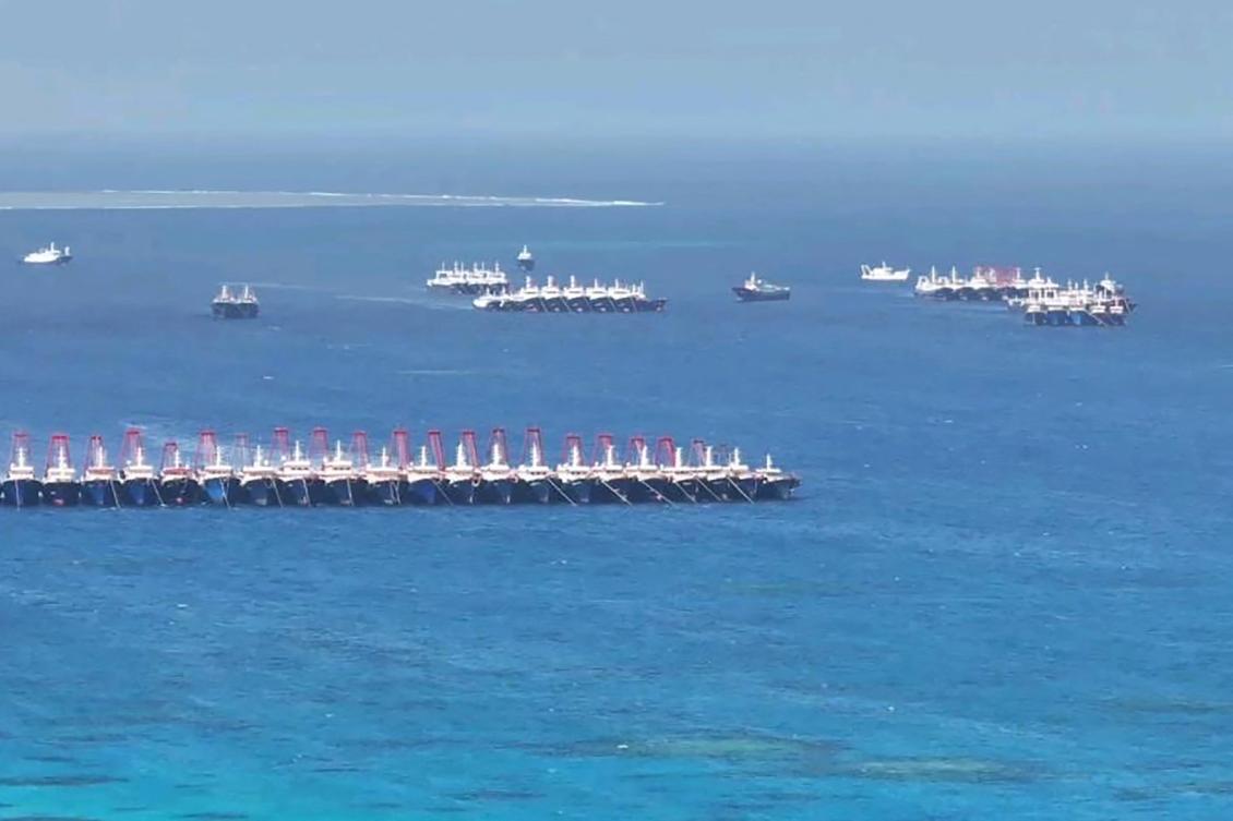 This handout photo taken on December 2, 2023 and released on December 3 by the Philippine Coast Guard (PCG) shows an aerial view of Chinese vessels gathered by Whitsun Reef, around 320 kilometres (200 miles) west of Palawan Island, in disputed waters of the South China Sea.(File/AFP)