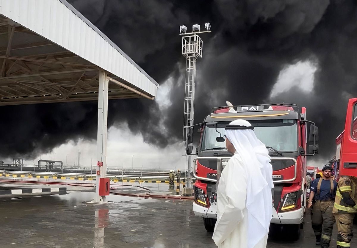 Kuwait's Defense Minister Abdullah Ali Abdullah Al-Sabah visiting the scene of a fire at Kuwait's International Airport after Iranian drones hit a fuel depot on Wednesday. (KUNA/AFP)