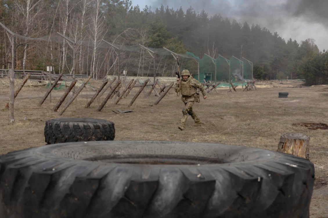 A Ukrainian recruit completes basic military training at the Ukrainian Ground Forces training center, in an undisclosed location on March 25, 2026, amid the Russian invasion of Ukraine. (AFP)
