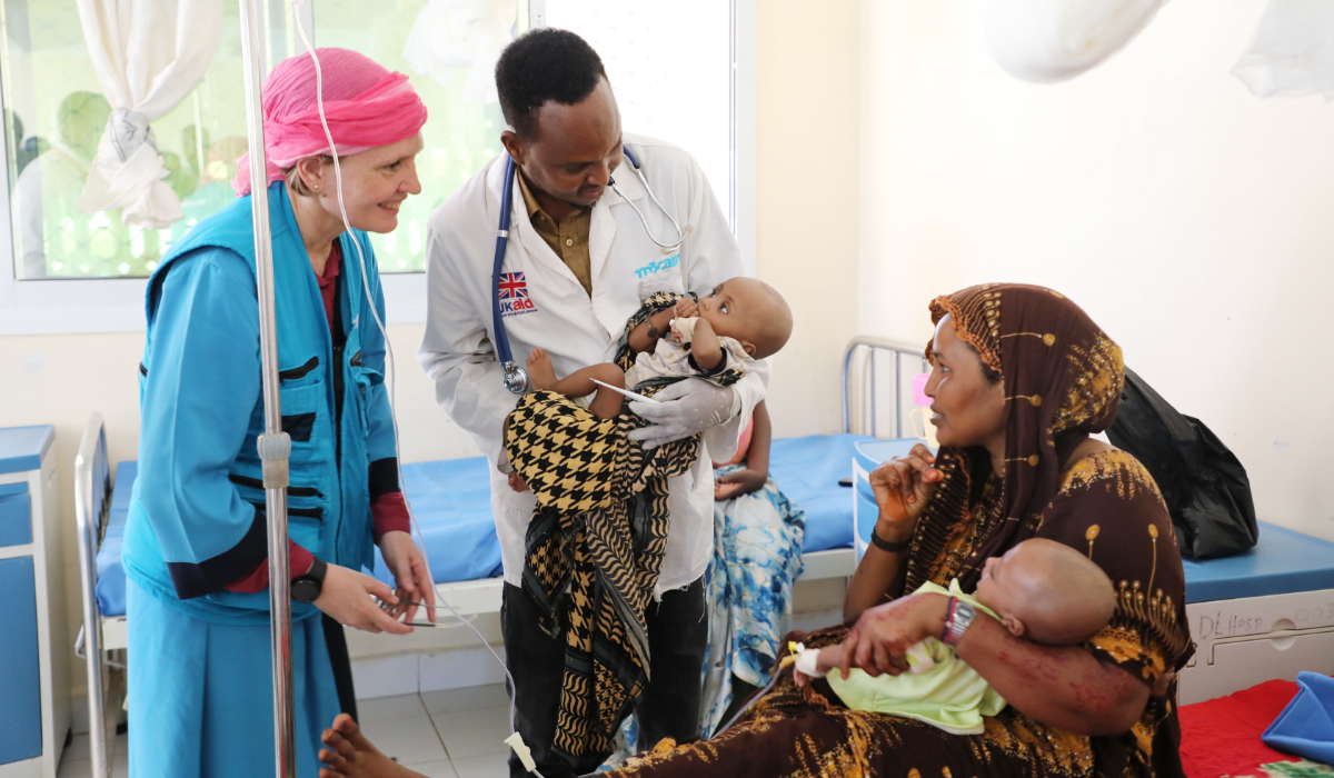 Sandra Lattouf, UNICEF Representative in Somalia, smiles at a mother of twin malnourished children at Dolow Referral Hospital in southern Somalia, Wednesday, March 25, 2026. (AP)