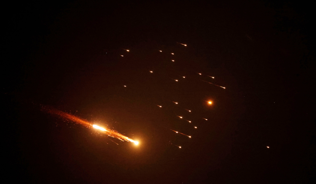 Rocket trails are seen in the sky above the Israeli coastal city of Netanya, amid a fresh barrage of Iranian missile attacks on March 27, 2026. (AFP)