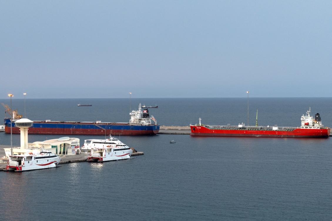 Above, vessels sit at anchor in Sultan Qaboos Port in Muscat, Oman on March 26, 2026 as maritime traffic at the Strait of Hormuz remains constricted. (Reuters)