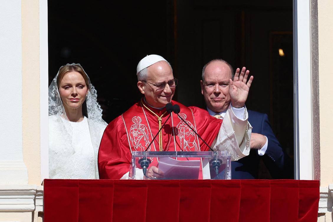 Pope Leo XIV waves as he gives a speech from the balcony next to Prince’s Albert II of Monaco, right, and Princess Charlene of Monaco at the Prince’s Palace of Monaco in Monte Carlo, Monaco, on March 28, 2026. (AFP)