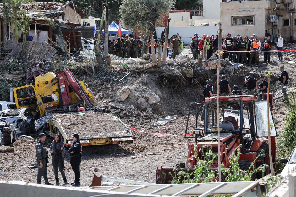 First responders and security forces work at the site of a projectile strike in Eshtaol, near Beit Shemesh in central Israel, on March 28, 2026. (AFP)
