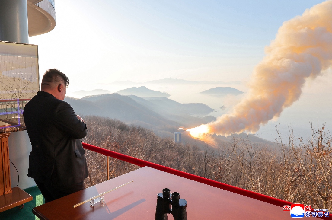 Undated photo shows North Korean leader Kim Jong Un inspecting a combustion test of a solid-fuel rocket engine at an undisclosed location in North Korea. (KCNA)