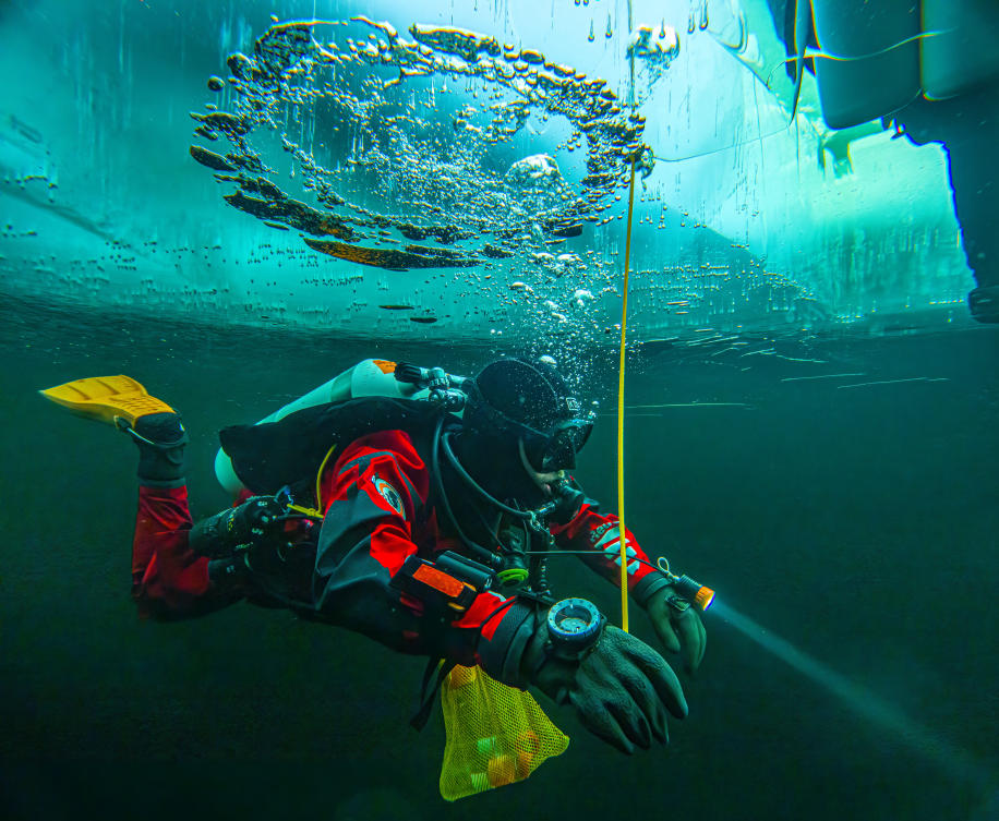 The sea beneath Arctic and Antarctic ice holds many secrets. These scientists dive deep to find out