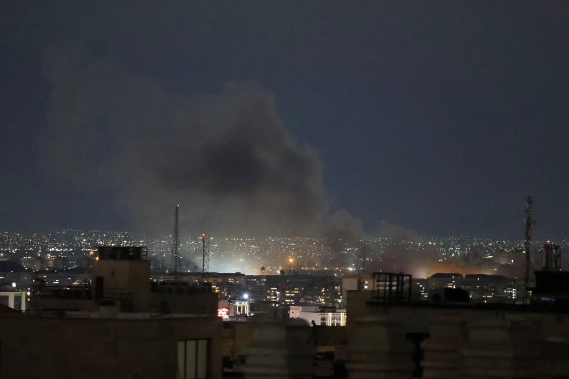 A plume of smoke rises from the site of a strike in Tehran early on March 28, 2026, as bnombardment by Israel and the United States continues. (AFP)