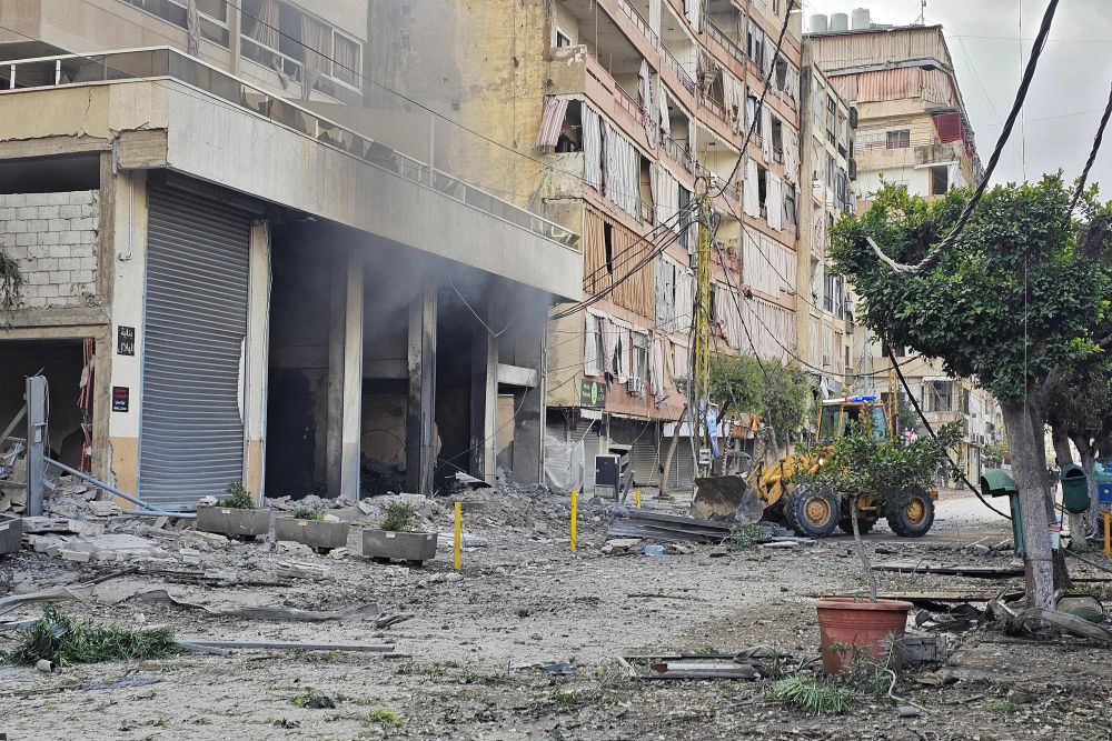 A bulldozer removes rubble from the site of an overnight Israeli airstrike on the Haret Hreik neighborhood in Beirut’s southern suburbs on March 30, 2026. (AFP)