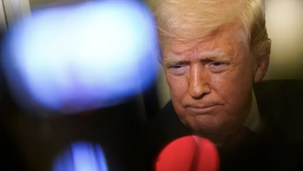 U.S. President Donald Trump looks on as he speaks to members of the media aboard Air Force One en route to Joint Base Andrews, Maryland, US, March 29, 2026. (Reuters)