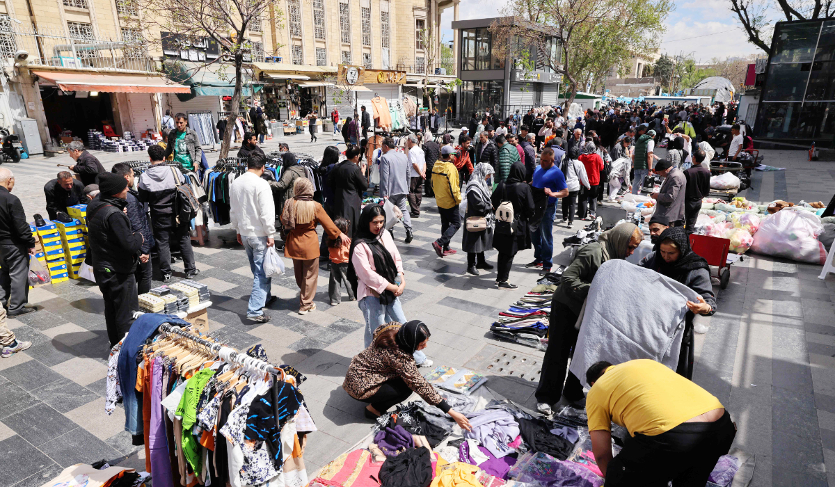 People shop at the Grand Bazaar in Tehran on March 30, 2026. (AFP)