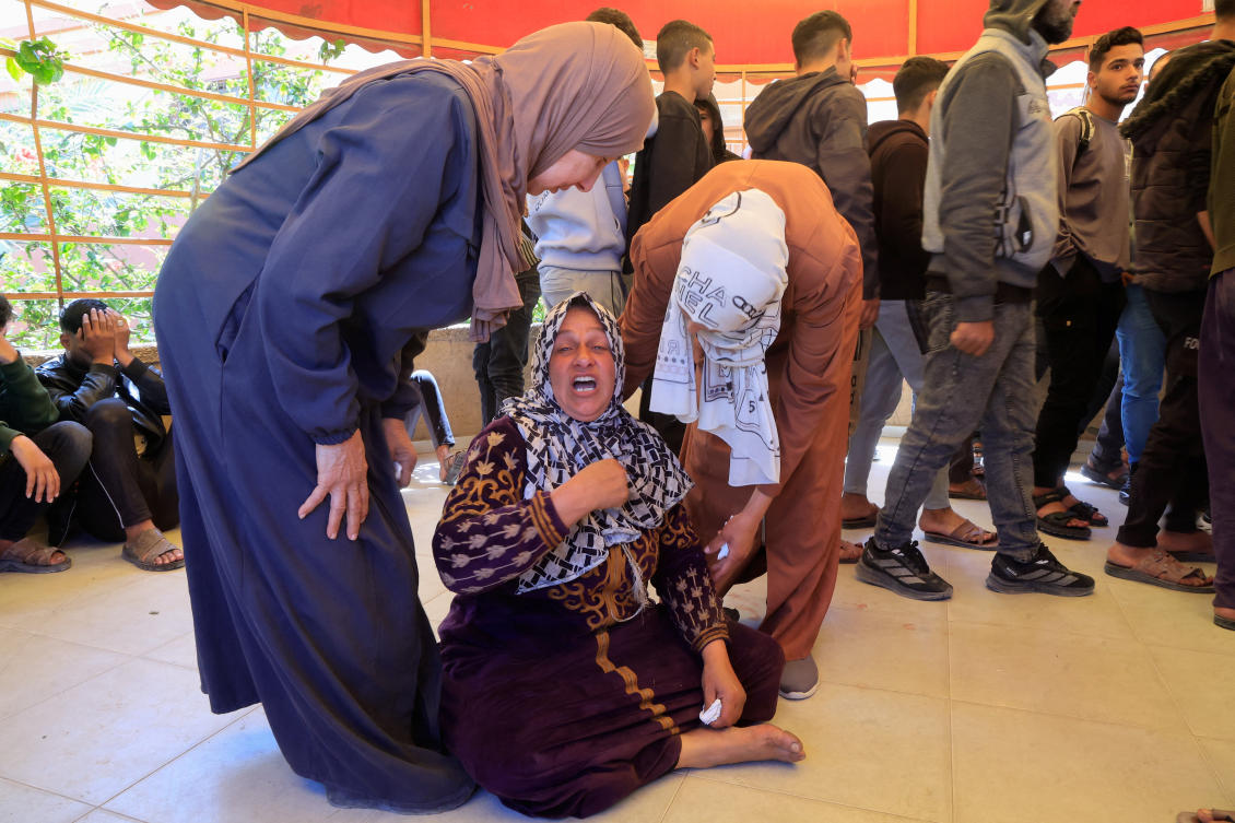 A mourner reacts during the funeral of a Palestinian father and his two-year-old son who were killed in an Israeli strike, at Nasser Hospital in Khan Younis, in the southern Gaza Strip, March 31, 2026. (Reuters)