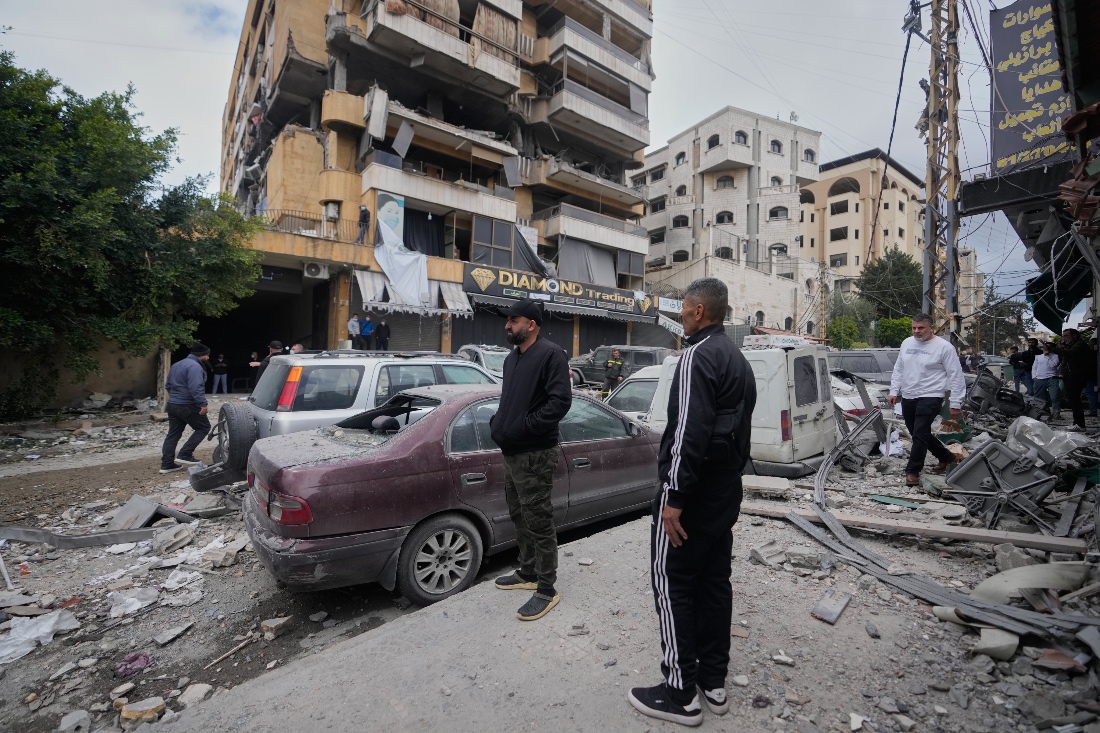 People check the site of an Israeli airstrike that hit an apartment building in Dahiyeh, Beirut's southern suburbs, Lebanon. (AP)