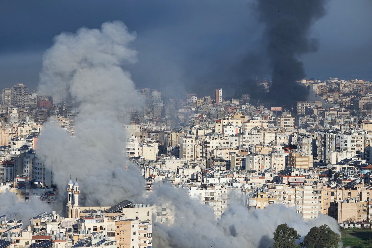 Plumes of smoke rise from the sites of Israeli airstrikes on the southern suburbs of Beirut. March 03, 2026 (AFP)