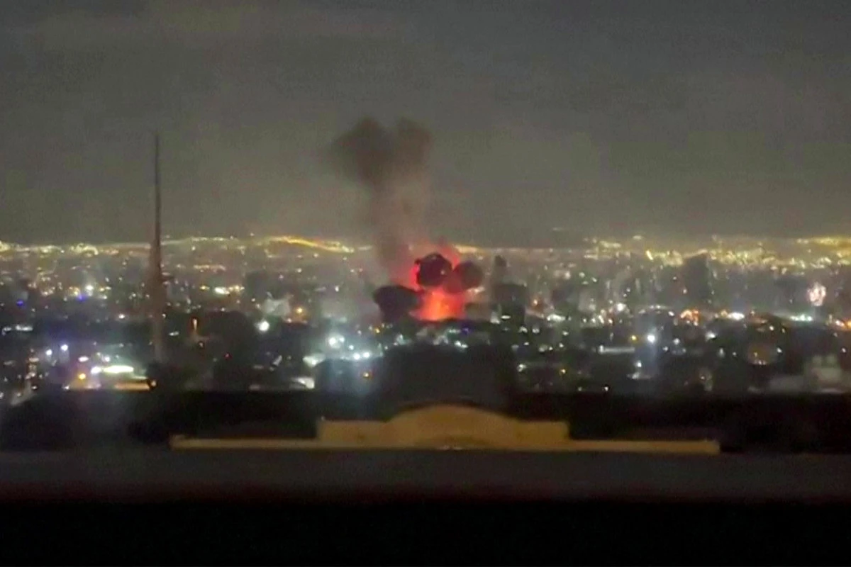 This video grab posted on social media on March 1, 2026 shows an explosion following a strike on Tehran. (AFP)