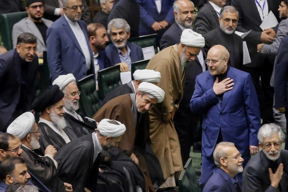 Mohammad Bagher Qalibaf is the highest-ranking official to appear on camera since the attacks began Saturday. Above, Qalibaf, right, greets lawmakers during the inauguration session for the new Parliament in Tehran on May 27, 2024. (AFP)