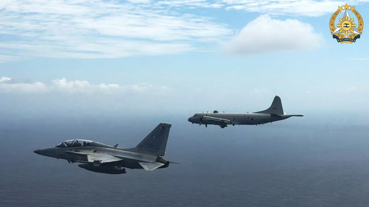 This handout photo taken on February 26, 2026 and released on February 27 by the Armed Forces of the Philippines-Public Affairs Office (AFP-PAO) shows a Philippine air force FA-50 fighter jet (L) flying alongside a Japan Maritime Self-Defence Force's P-3 Orion maritime patrol aircraft during a joint military exercise in the disputed South China Sea. (AFP)