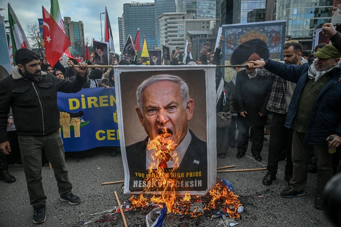 Protestors set fire to an image depicting Israeli Prime Minister Benjamin Netanyahu at a protest against the US and Israel attack of Iran in front of Israel Consulate in Istanbul, Turkiye.