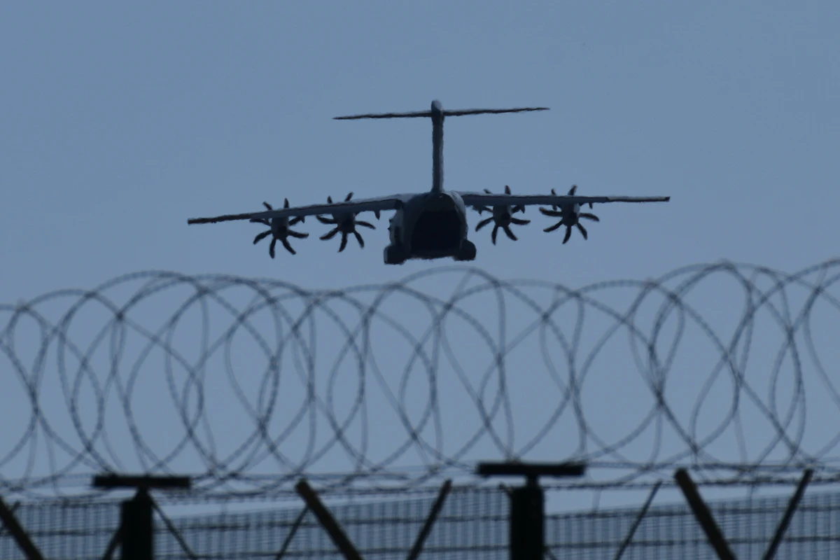A transport aircraft prepares for landing at U.K.'s RAF Akrotiri air base near Limassol, Cyprus, Tuesday, March, 3, 2026. AP Photo/Petros Karadjias