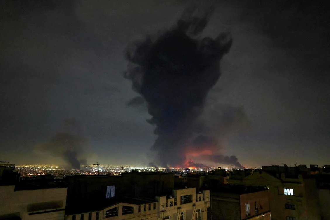 Smoke rises from the Mehrabad International Airport on March 7, 2026 after Israel said it had launched “broad-scale” strikes on targets in Tehran. (AFP)