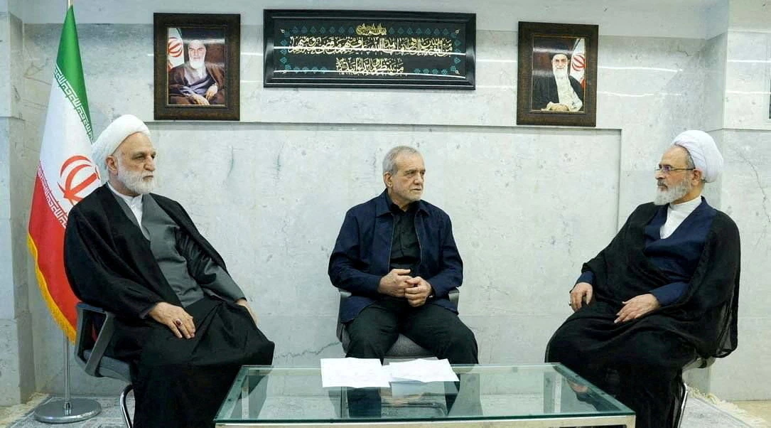 Iranian President Masoud Pezeshkian, Gholam-Hossein Mohseni-Eje’i, the head of the judiciary and Alireza Arafi, deputy chairman of the Assembly of Experts, attend the meeting of the interim leadership council of Iran in an unknown location in Iran on March 1, 2026. (WANA via Reuters)