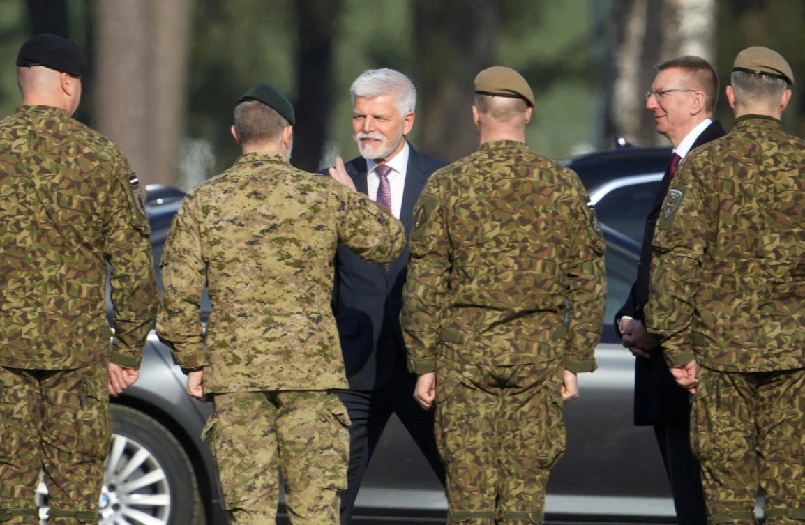 Latvian President Edgars Rinkevics and Czech President Petr Pavel visit the NATO enhanced Forward Presence brigade in Latvia at Adazi military base, Latvia, on March 11, 2026. (REUTERS/Ints Kalnins)