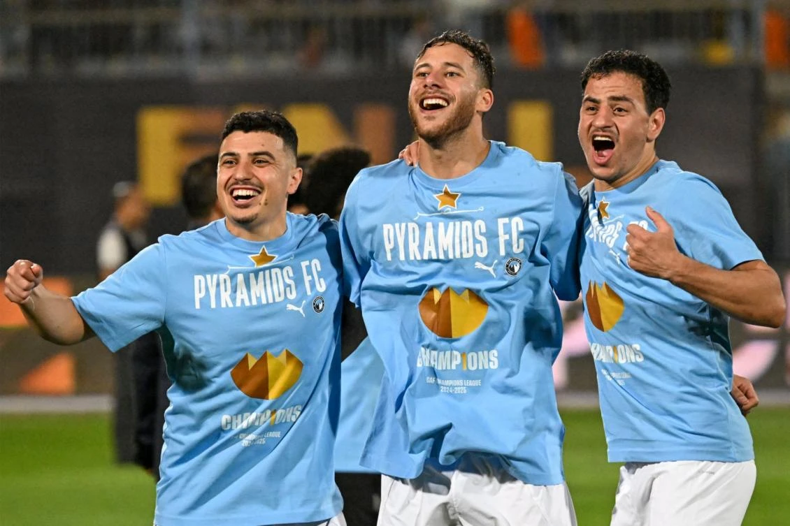 Pyramids' players celebrate after winning the second leg of the CAF Champions League final football match between Pyramids FC and Mamelodi Sundowns at 30 June Stadium in Cairo on June 1, 2025. (Photo by Khaled DESOUKI / AFP)
