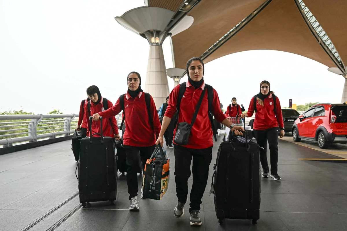 Members of Iran's women's football team arrive at the Kuala Lumpur International Airport in Sepang on March 16, 2026. (AFP)
